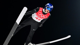 Japan's Kobayashi holds nerve to win Olympic ski jumping gold