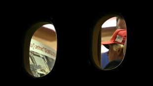 AFP photo shows Trump examining image of Kennedy Center apparent demolition
