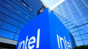 US chip maker Intel says revenue rose as it cut ranks