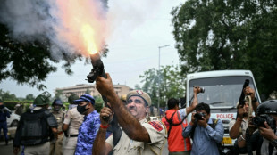Indian police fire tear gas, baton charge exam protesters 