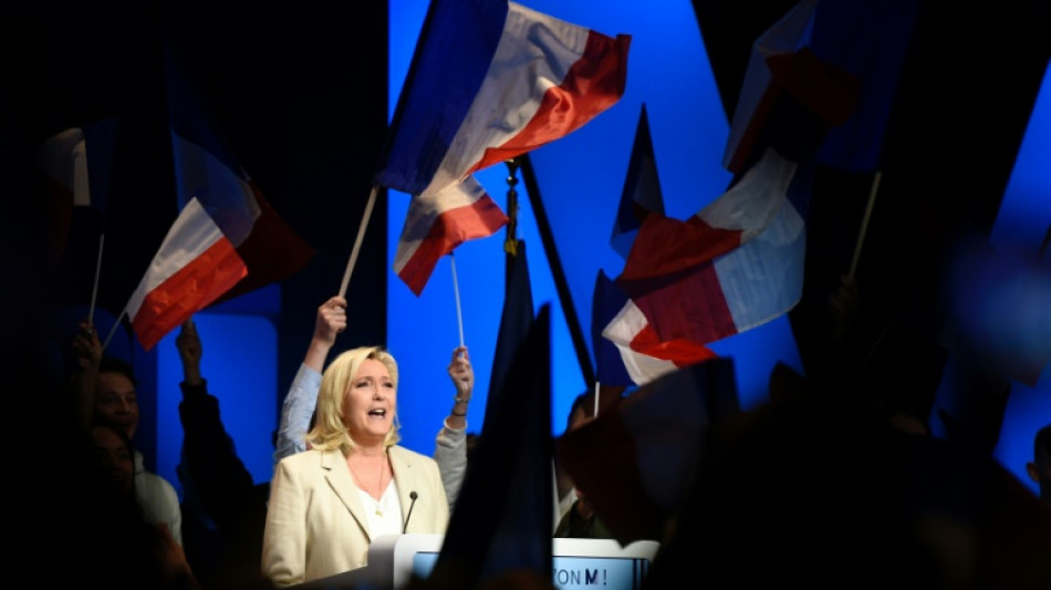 Le Pen vows headscarf fines in tight French election battle