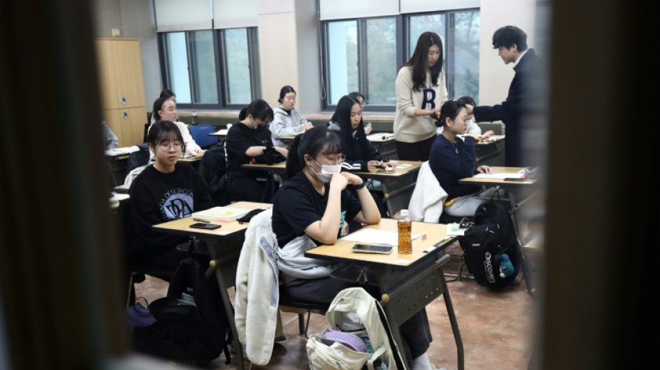 South Koreans sit key exam as flights halted to limit distraction