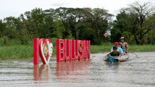 Boats bring Philippine flood victims to safety as death toll rises