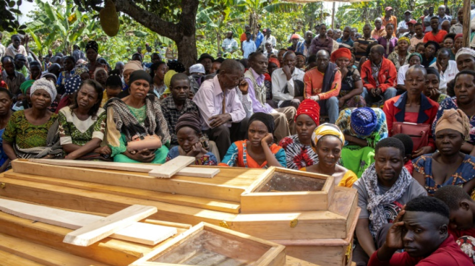 Ugandans bury more victims of horrific school massacre