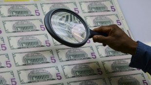 Stocks down with eyes on Mideast, dollar hit by Trump Fed comment