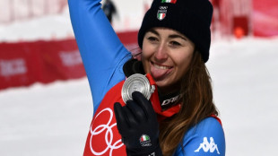 Goggia skis through pain barrier to take Olympic downhill silver