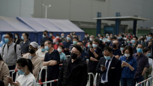 Beijing Covid spike prompts mass testing, panic buying