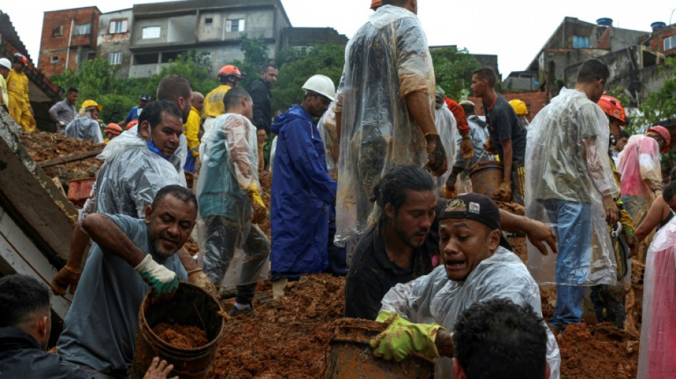 Rescuers dig desperately in mud for Brazil flood survivors
