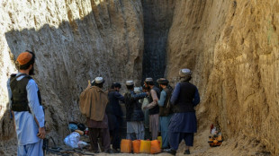 Rescuers near boy trapped in Afghan well, but rock blocks progress