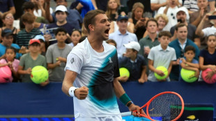 Cobolli claws out five-set victory at rain-hit US Open