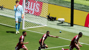 Qatar earn first ever World Cup point with late goal