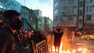 After dark, Iran security forces take aim at protest buildings