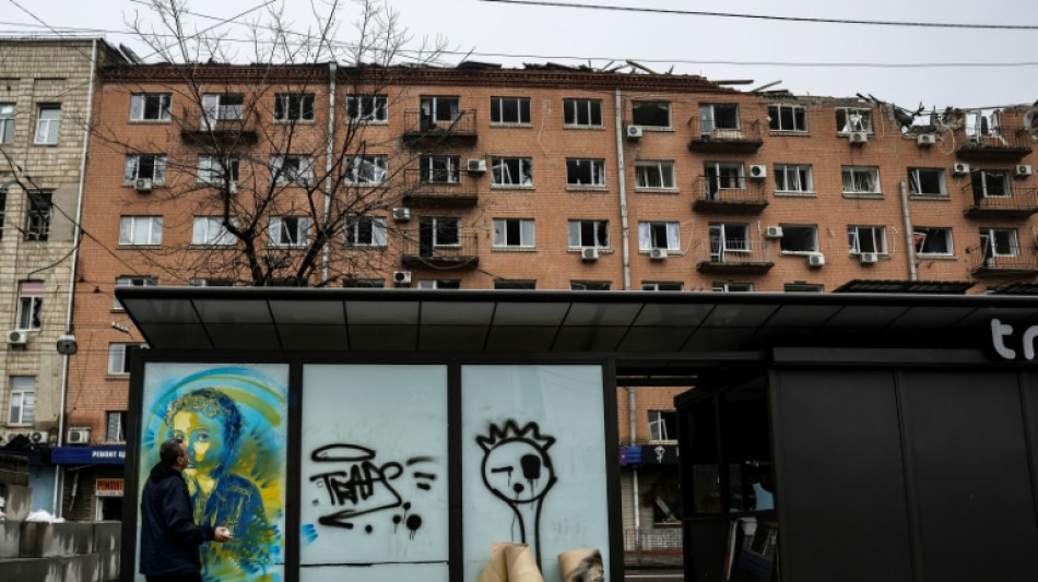 French artist sprays 'smiles and humanity' on Ukraine walls