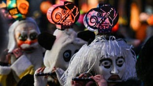Lanterns light the way as Basel carnival comes back