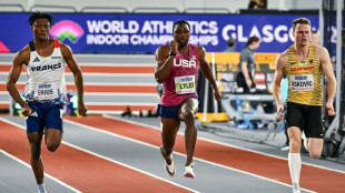 Lyles leads big names into world indoor semis, Mitton wins shot