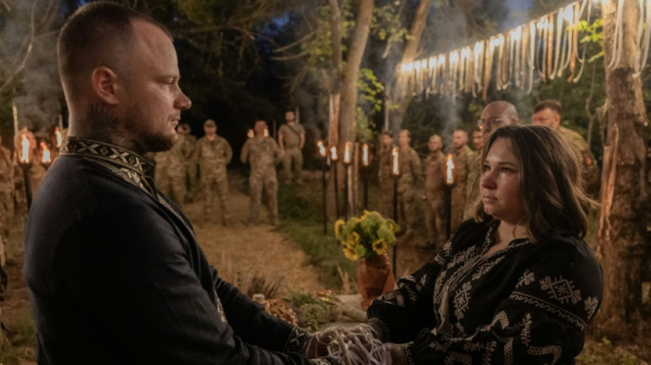 Amid war, Ukrainian soldiers celebrate love at ritual wedding