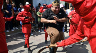 Devils whip sinners in El Salvador Holy Week tradition