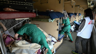 Speeding west, Ukraine hospital train ferries patients to safety