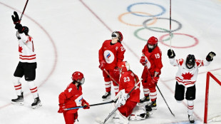 Olympic hockey players wear Covid face masks during match