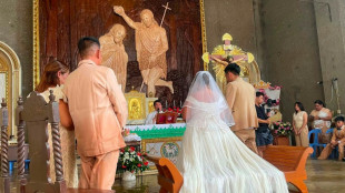 Philippine couple married in hip-deep floodwaters