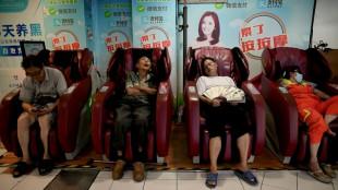 Gimme shelter: older Chinese take refuge from heatwave in subways