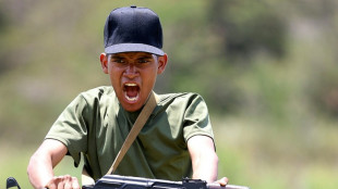 'With our fists if necessary': Venezuelans prepare to defend homeland against potential US invasion