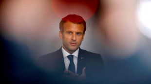 Eyeing new term, Macron walks tightrope on vaccinations