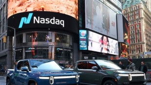 Nasdaq ends bruising January on a positive note