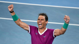 Nadal comes from two sets down to make history with 21st Slam