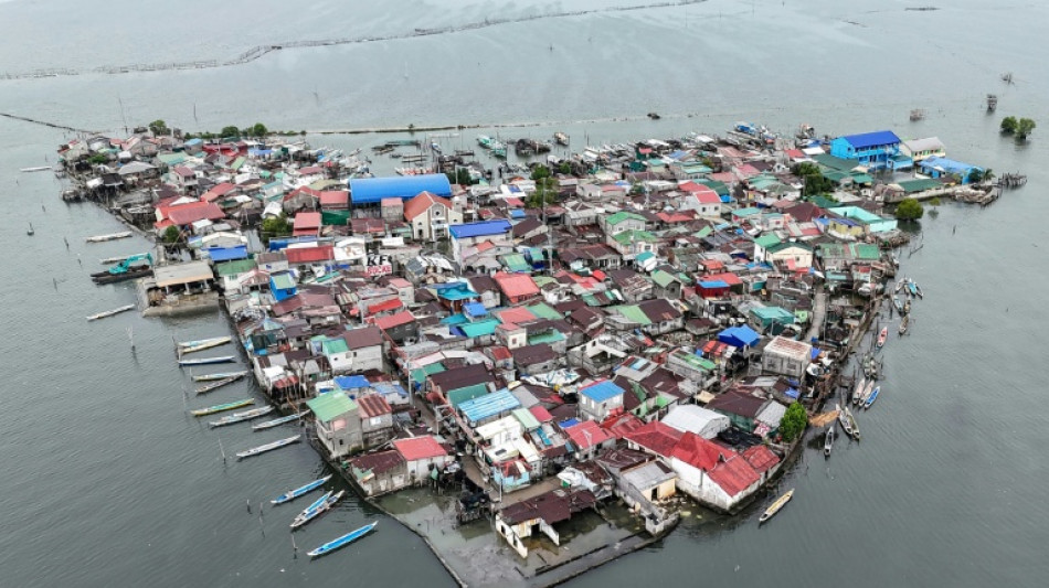 Against the tide: Filipinos battle rising sea on sinking island