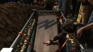'Gave his youth for us': Hundreds mourn iconic Ukrainian soldier