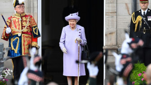 Queen's coffin heads to Scottish palace, historic church