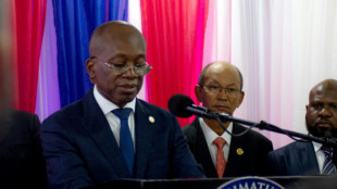 Haiti transitional council sworn in as gunshots ring out