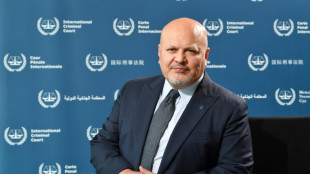 ICC prosecutor, under investigation, steps aside temporarily