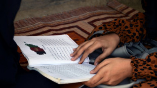 Afghan girls head back to school as Taliban end ban
