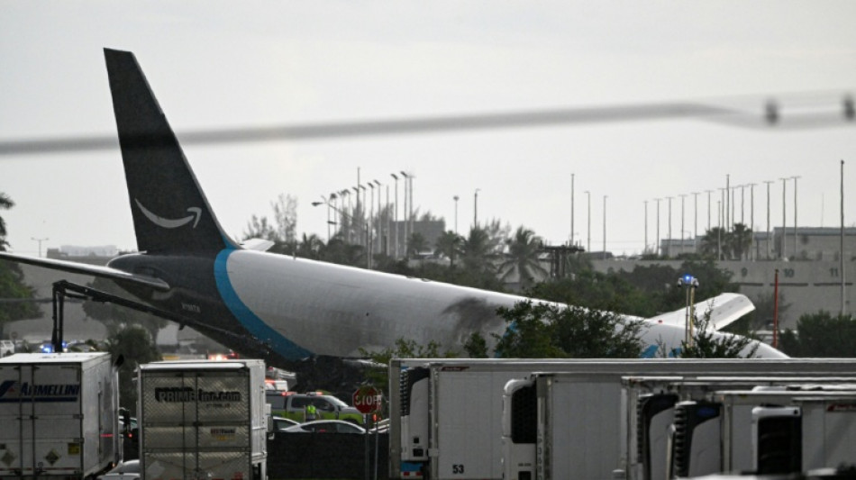 Amazon cargo plane overshoots Miami runway, hits vehicles, catches fire
