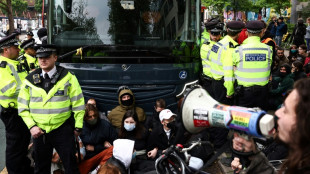 Protesters try to stop UK migrant removals from temporary accommodation 