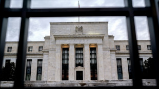 US shares reverse course as Fed signals likely March rate hike
