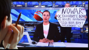 Russian court fines TV protester amid outcry