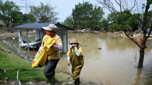 Victims of China floods race to salvage property